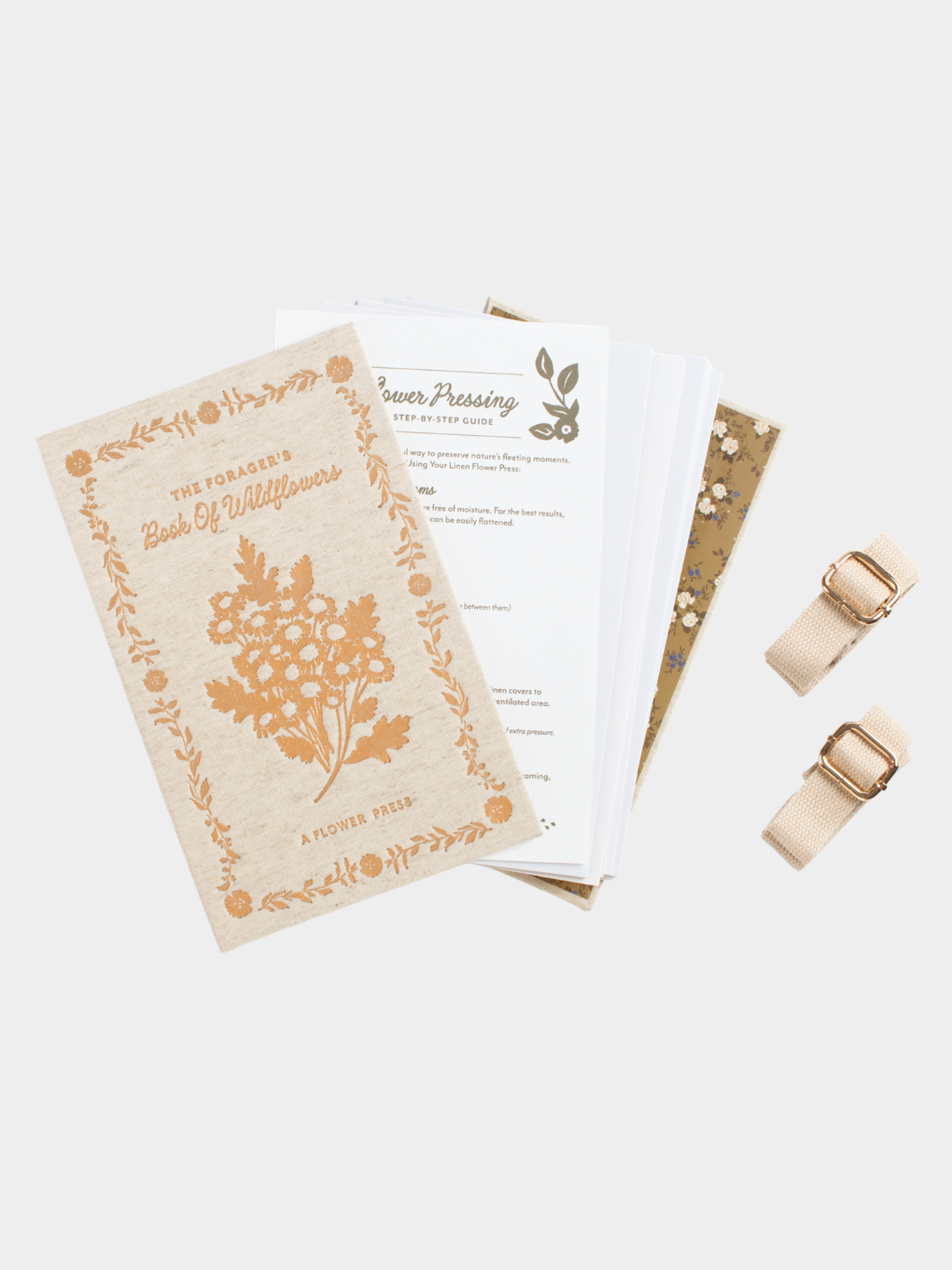 Linen Flower Press Book with its instruction sheet, acid free matboards and cotton webbing straps with gold buckles