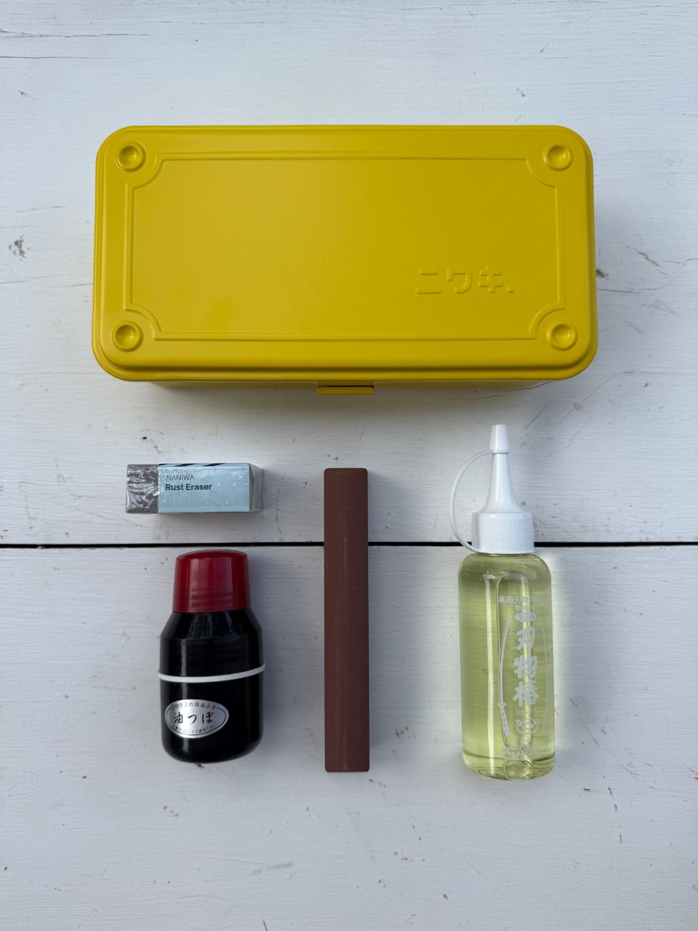 bugg Blade Box in yellow, a Niwaki T-Type steel toolbox holding a Japanese garden tool care kit.
