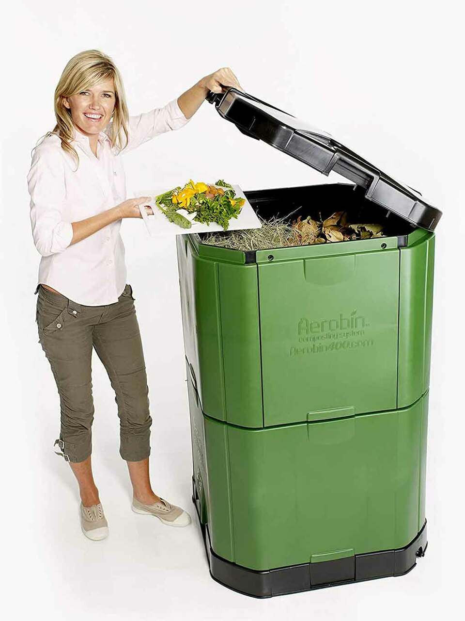 Aerobin 400 Litre compost bin in a garden setting, showing its durable construction and ventilation features for efficient composting.