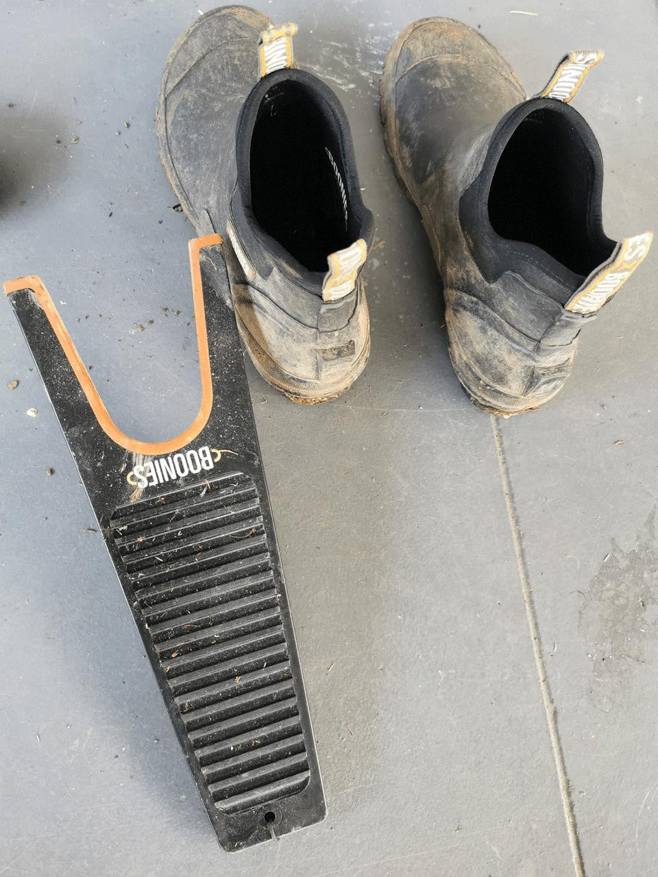 Boonies Boot Remover with ergonomic handle and sturdy design for easy removal of muddy or wet boots.