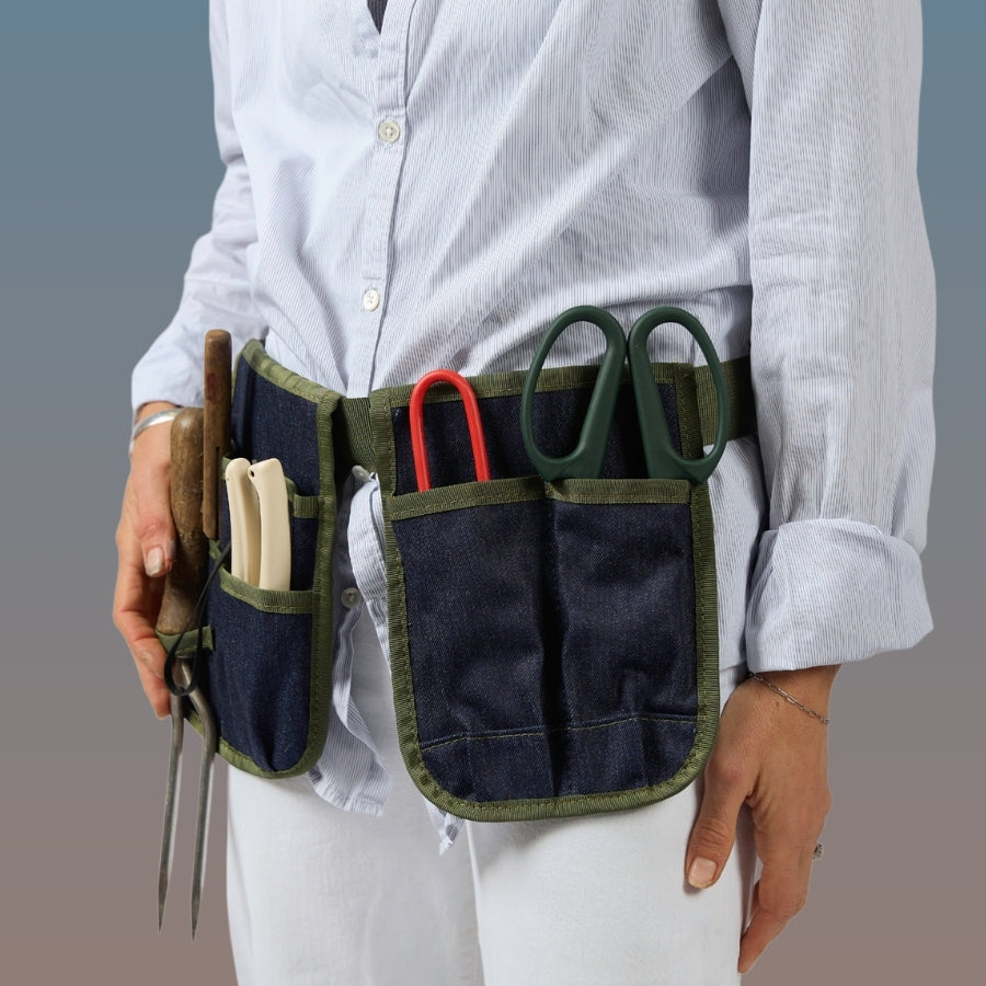 Bugg Limited Edition denim tool pouch with multiple compartments and sturdy strap for carrying tools easily.
