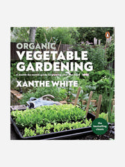 Organic vegetable gardening book by Xanthe White from Bugg NZ, featuring a cover image with vegetables and gardening tools.