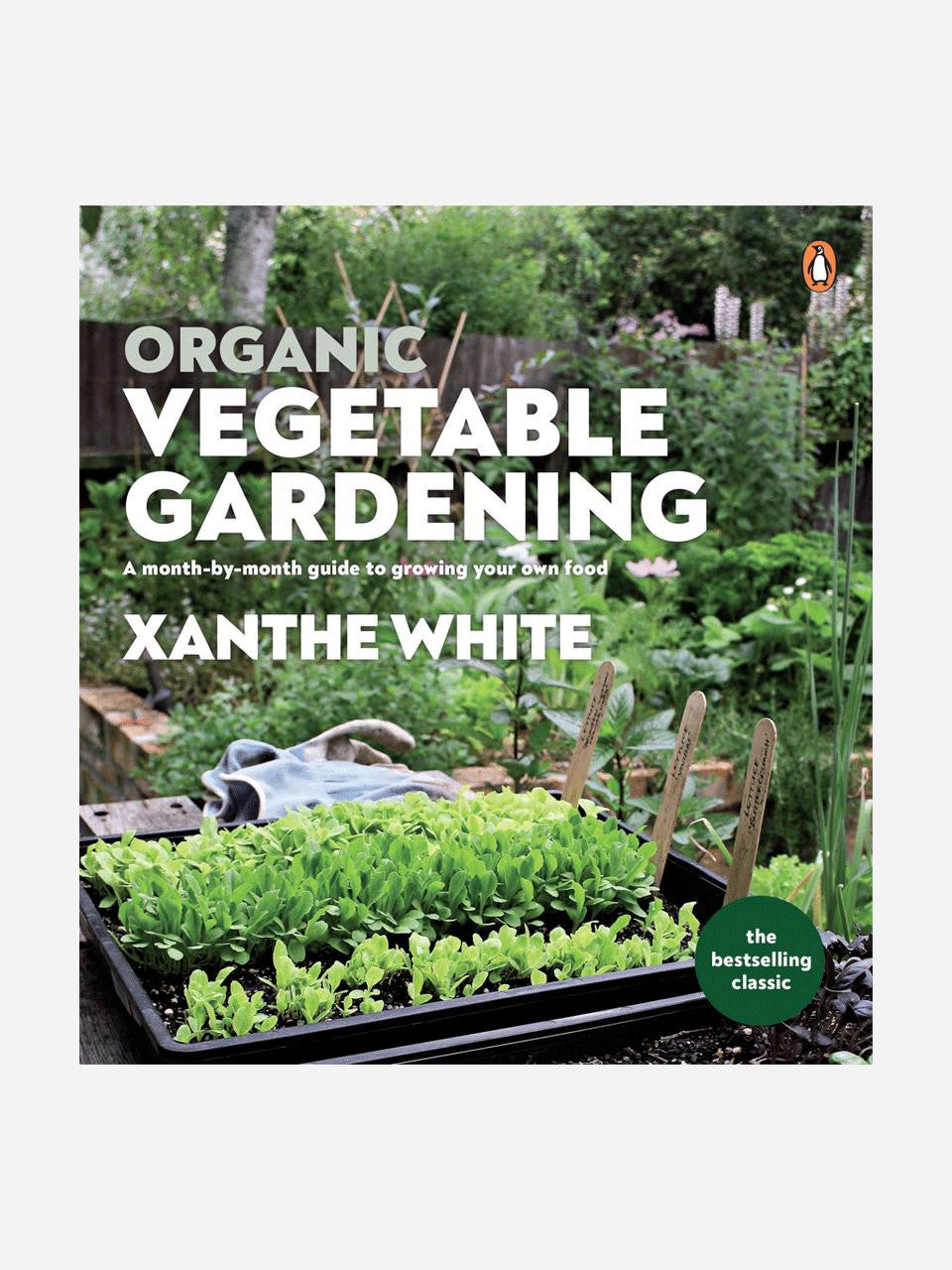 Organic vegetable gardening book by Xanthe White from Bugg NZ, featuring a cover image with vegetables and gardening tools.