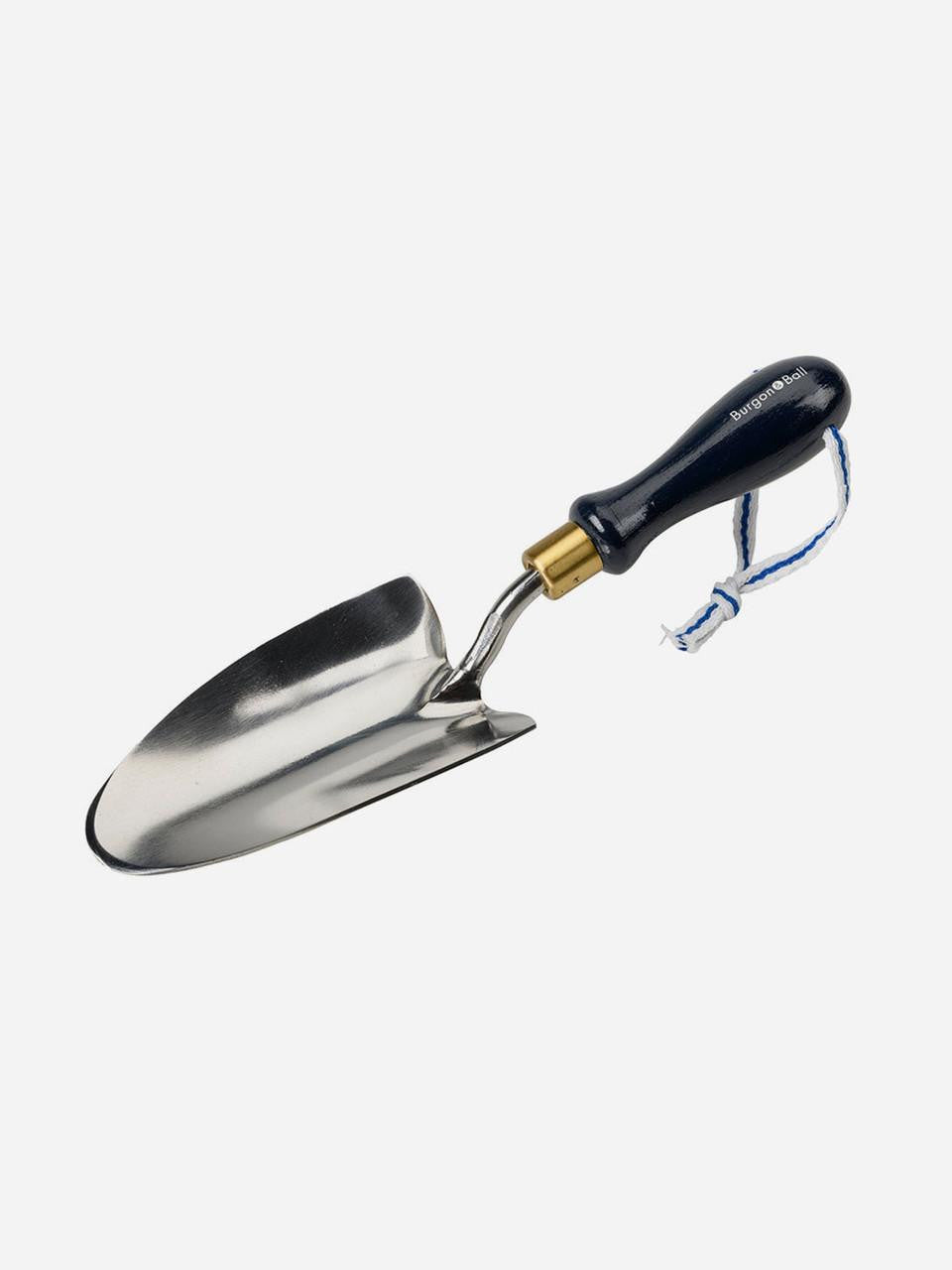 Navy-colored Burgon & Ball Collector Hand Trowel with a wooden handle for gardening and planting tasks.