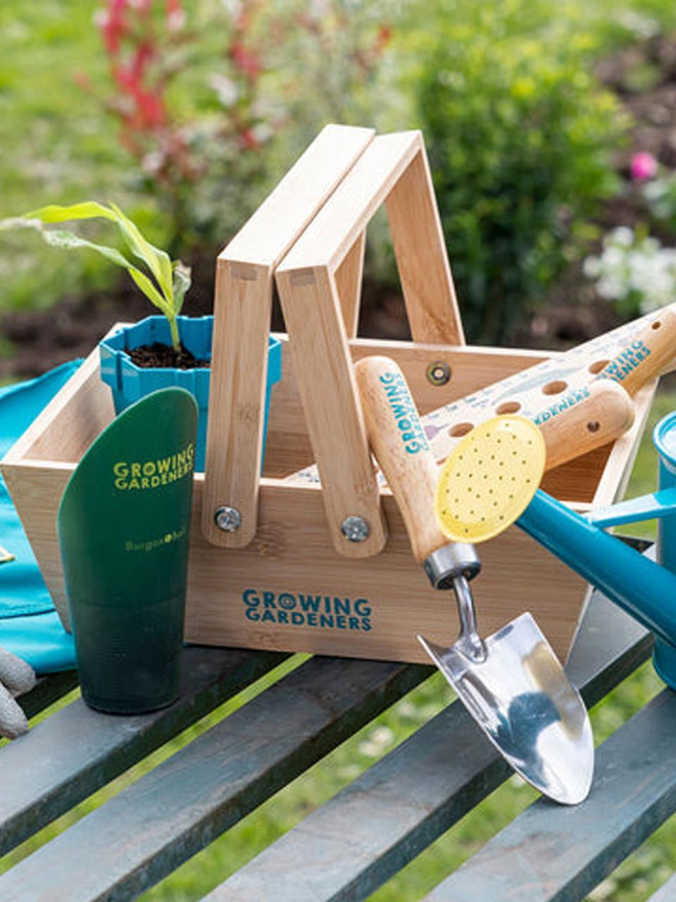 Set of three Burgon & Ball soil scoops with wooden handles, ideal for gardening and planting tasks.