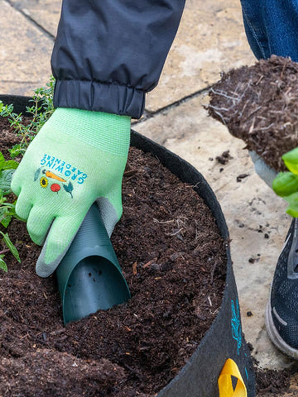 Set of three Burgon & Ball soil scoops with wooden handles, ideal for gardening and planting tasks.