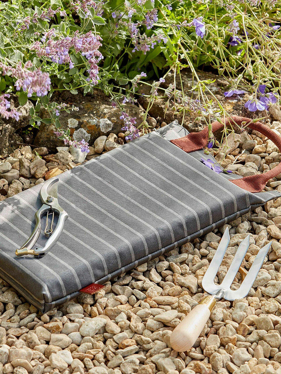 Navy Sophie Conran kneeler by Burgon & Ball with cushioned surface for gardening comfort and support.