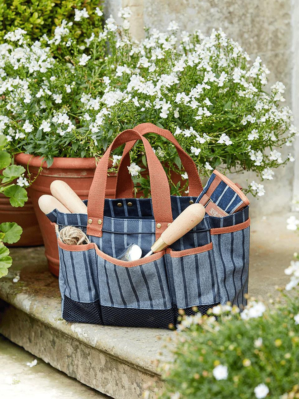 Navy Sophie Conran Tool Bag by Burgon & Ball with sturdy handles and multiple compartments for gardening tools.