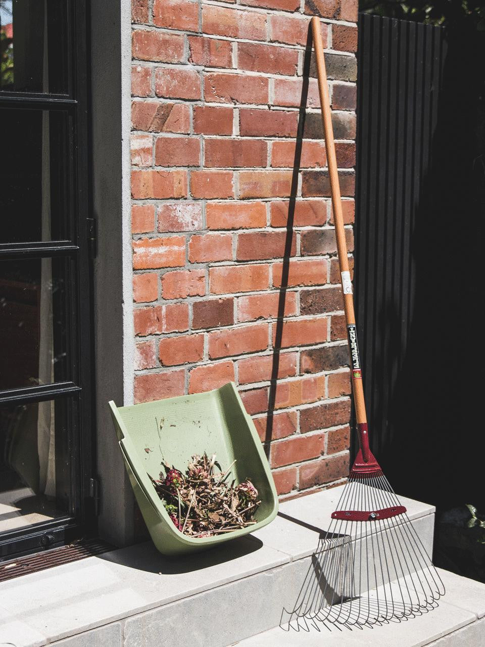 Elephant Tools rake with metal tines and wooden handle for gardening and yard work.