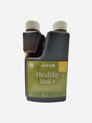 Healthy Soil+ by EMNZ, organic soil amendment with rich nutrients, shown in a close-up of dark, fertile soil ready for planting.