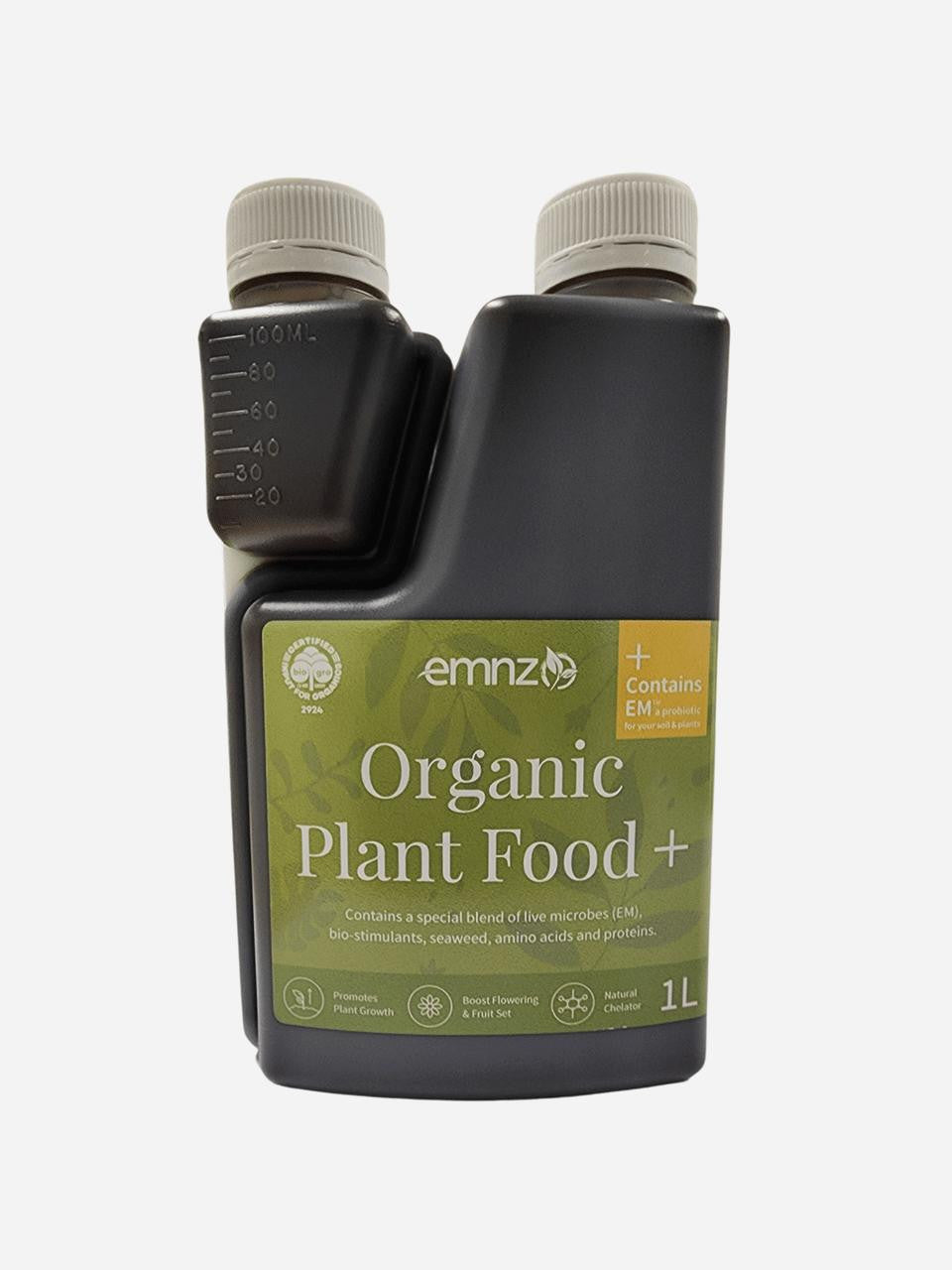 Organic plant food by EMNZ, showing a close-up of the nutrient-rich fertilizer granules in a natural setting.