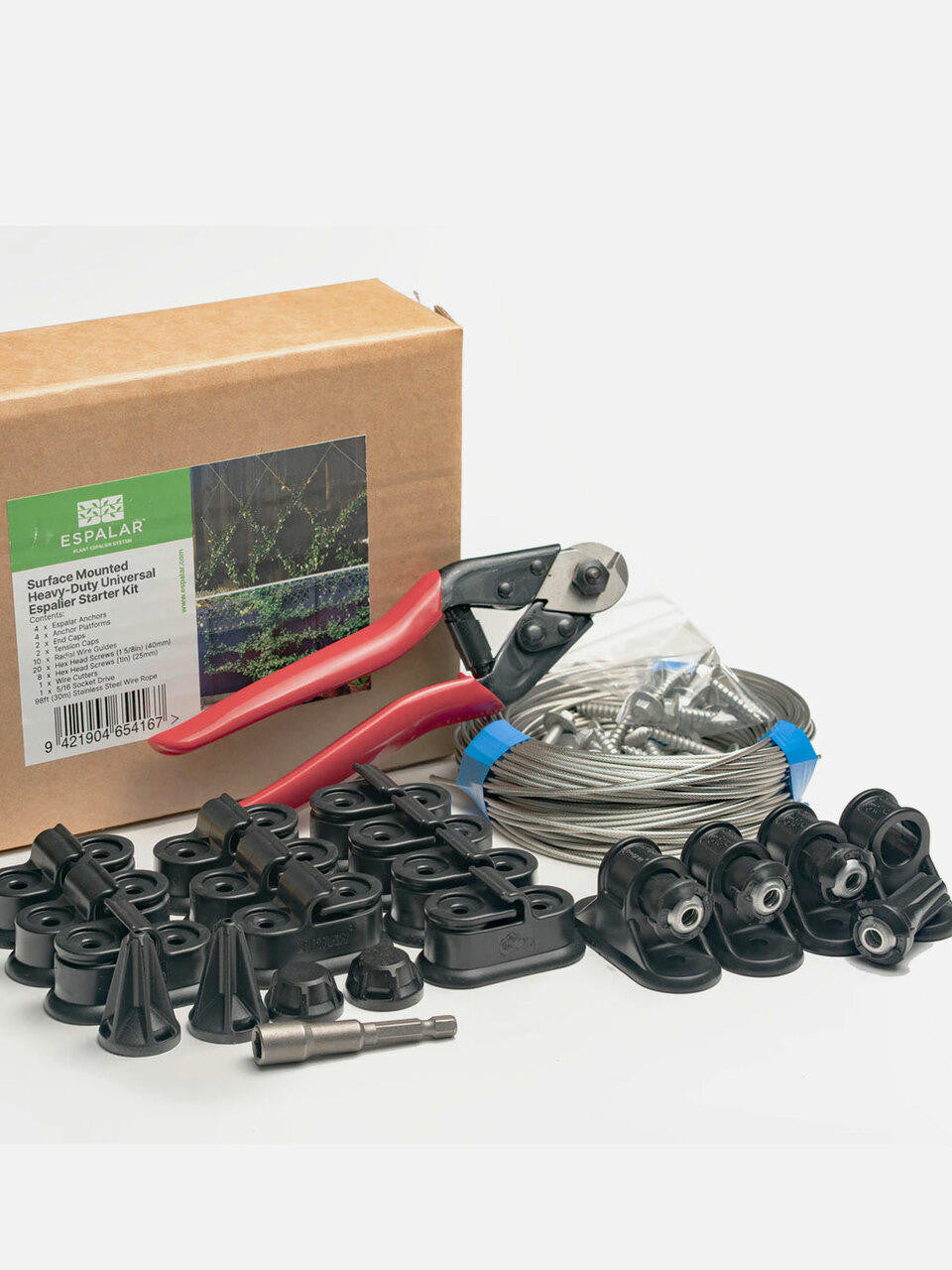 Surface mounted universal espalier starter kit with tools and wire from Espalar, featuring components for garden plant training.