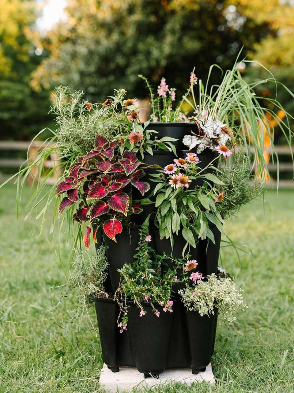 GreenStalk 3-tier vertical planter in elegant black, showcasing multiple planting levels for gardening and decorative use.