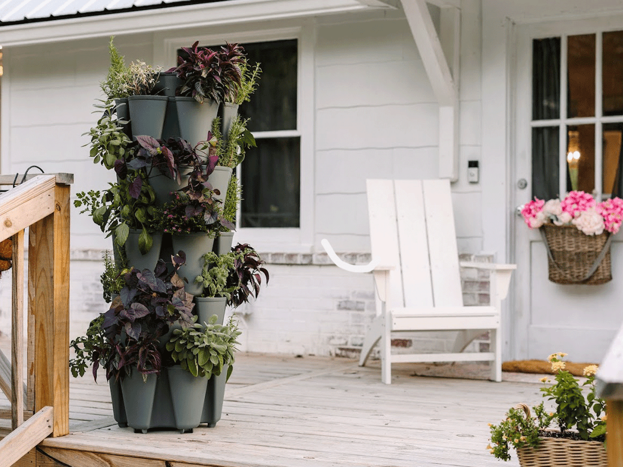 GreenStalk 5-tier vertical planter in sleek black, showcasing multiple planting tiers for urban gardening and decorative plant display.