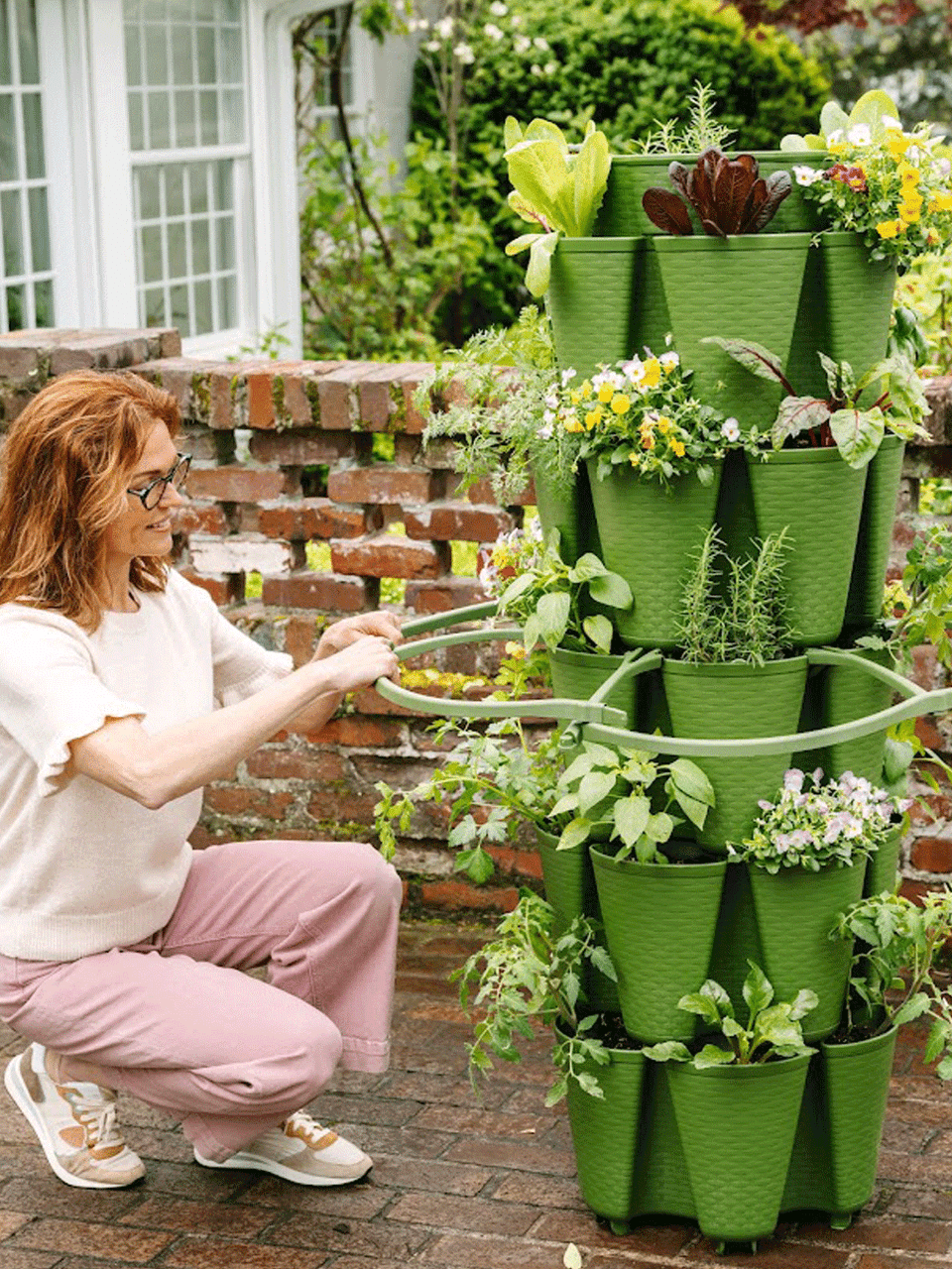 GreenStalk plant support for single plants, plastic stake with adjustable clips for garden or indoor use.
