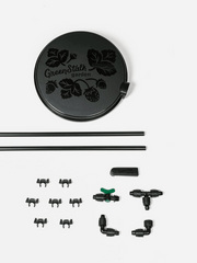 GreenStalk Spring Automatic Watering System for garden pots, featuring adjustable watering components and a compact design.