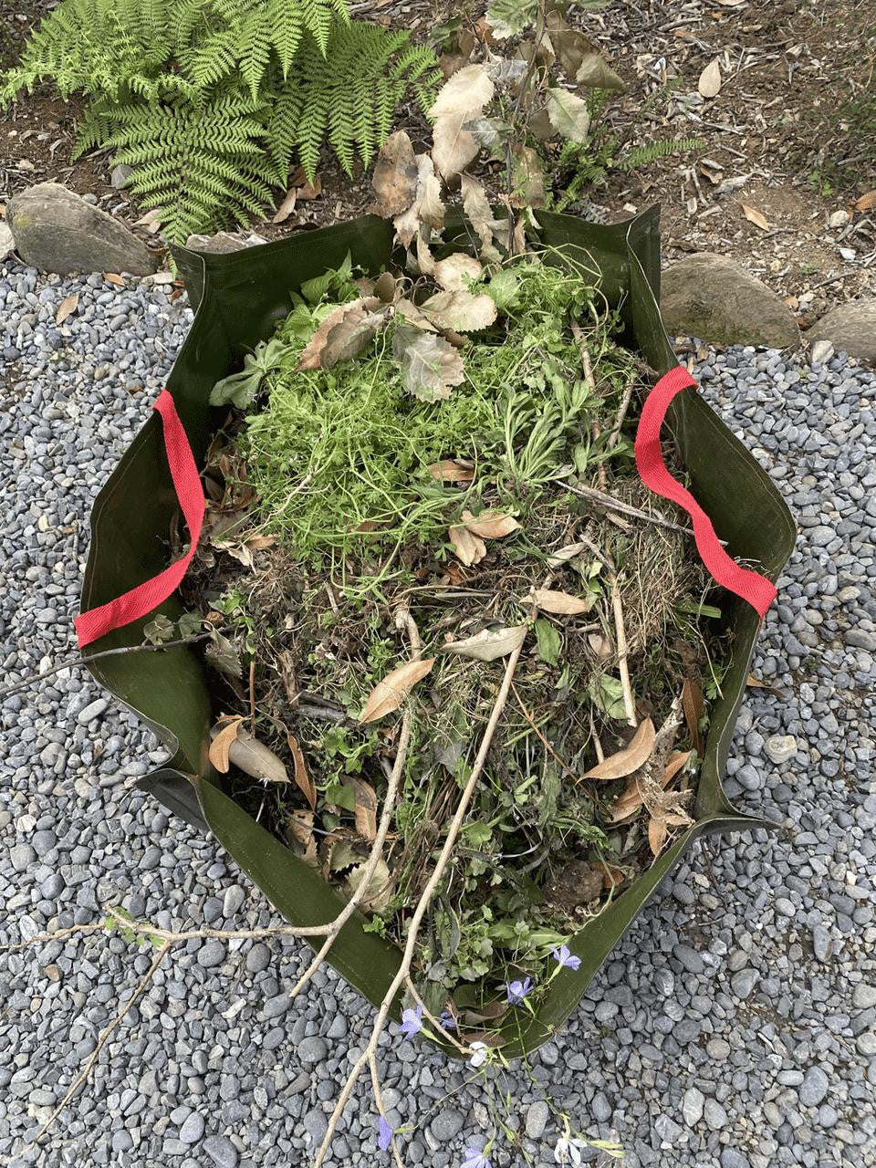 Gubba garden bag wrapped for storage, durable fabric with handles, ideal for outdoor gardening and yard waste collection.