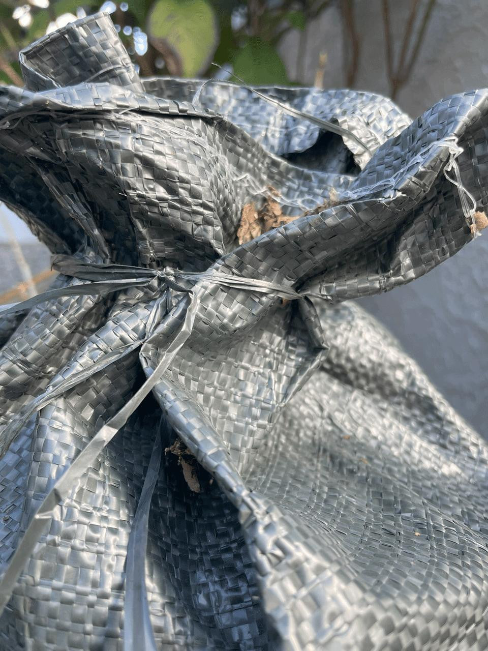 Sandbag in green showing durable fabric and reinforced stitching for long-term use — Bugg