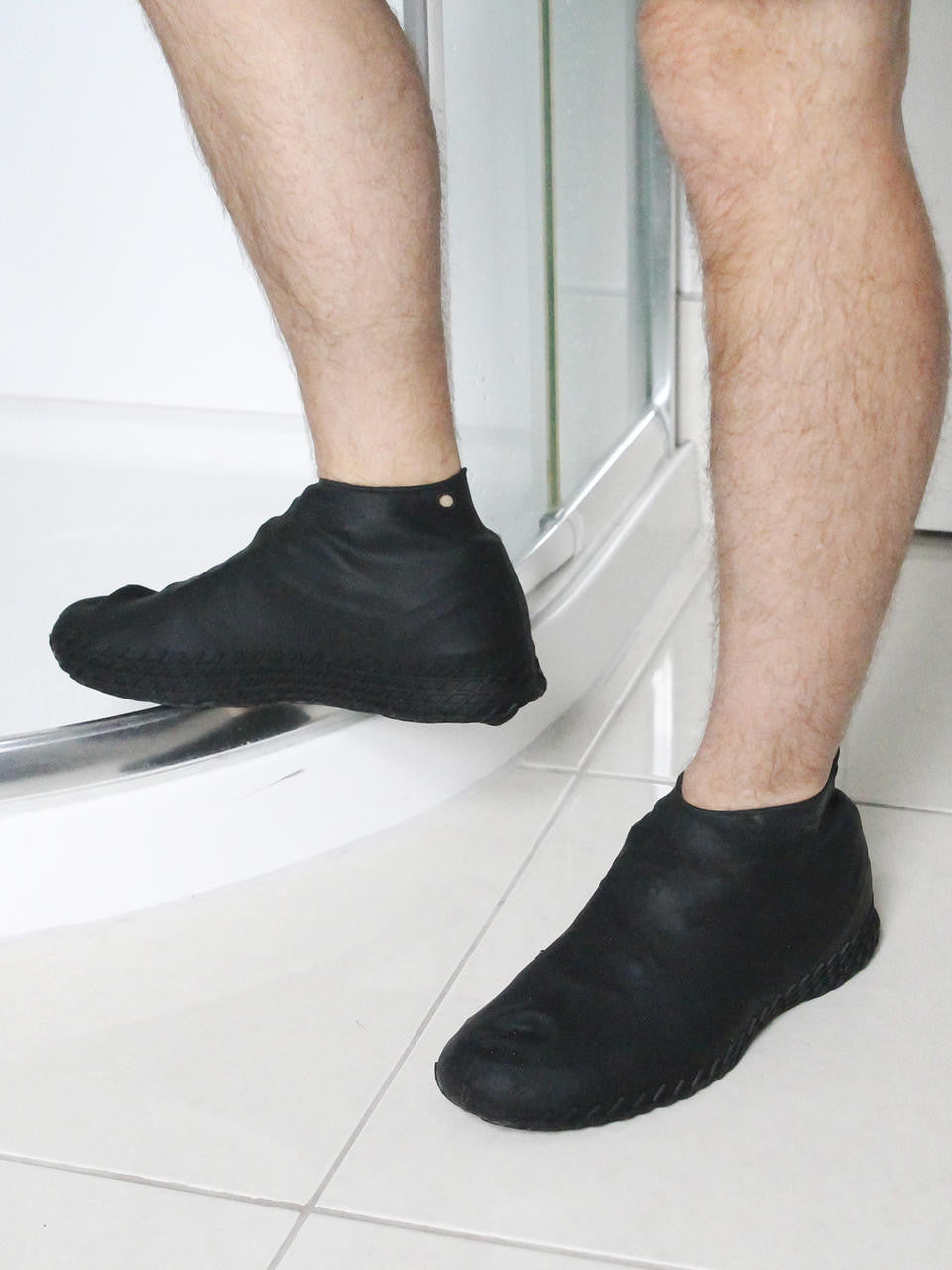 Gubba silicone overshoes in transparent design, showing flexible waterproof footwear for protection against wet conditions.