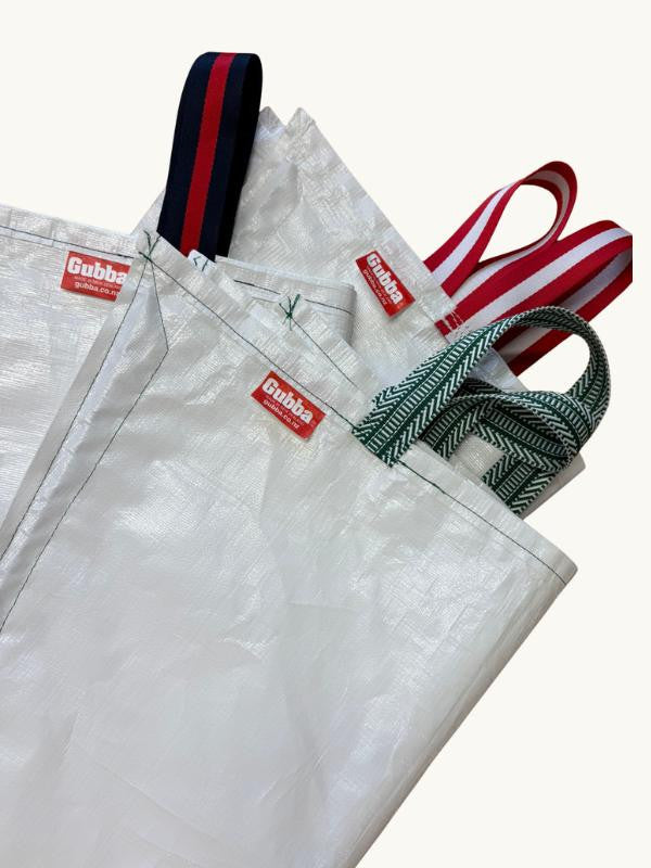 Navy Gubba laundry bag made of durable fabric with a drawstring closure and carrying handle for easy transportation.