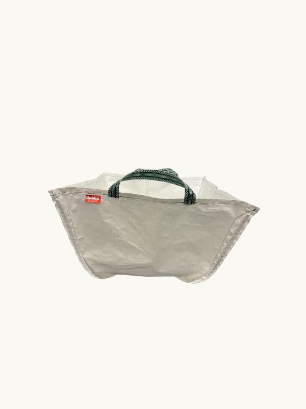 Navy Gubba laundry bag with handles, made of durable fabric, suitable for laundry organization and storage.
