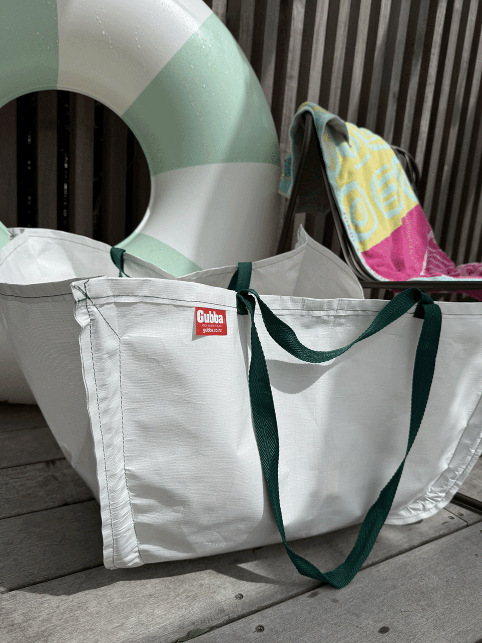 Red Gubba Everything Else Bag showing multiple compartments and a sturdy strap for versatile storage and organization.