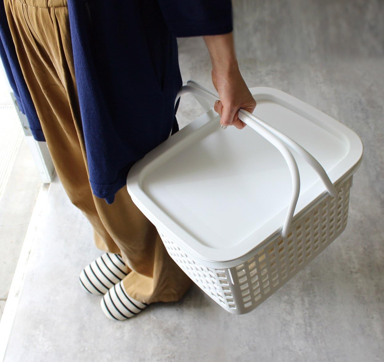 Small black Hachiman basket with lid, made of woven material for storage and organization in home or office.