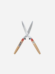 Kamaki Hedge Shears 1050 with ergonomic handles for precise pruning of hedges and shrubs in garden.