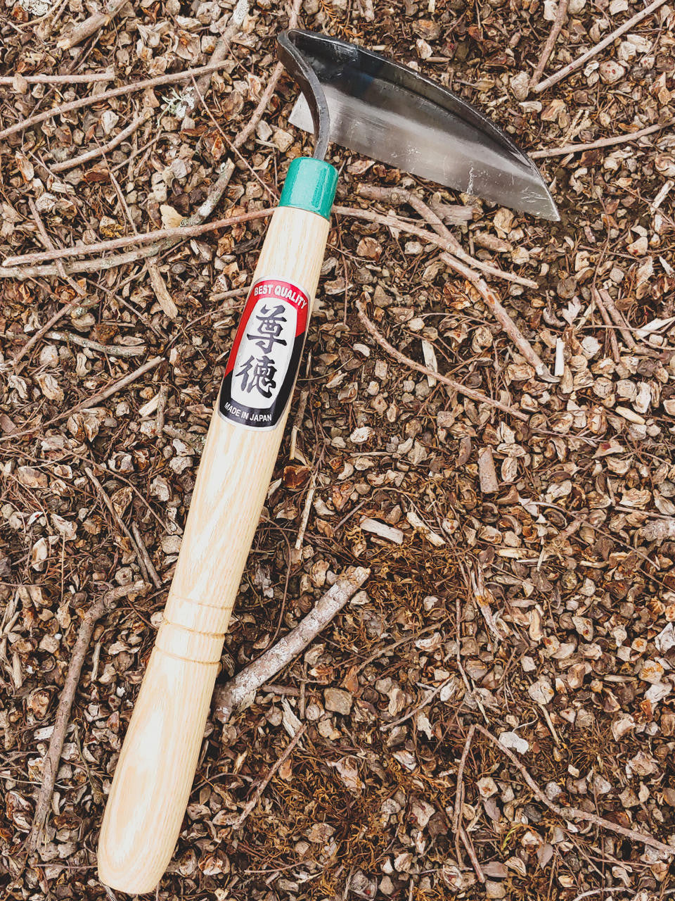 Maruyoshi left-handed garden hoe showing sturdy wooden handle and metal blade for weeding and hoeing — Bugg