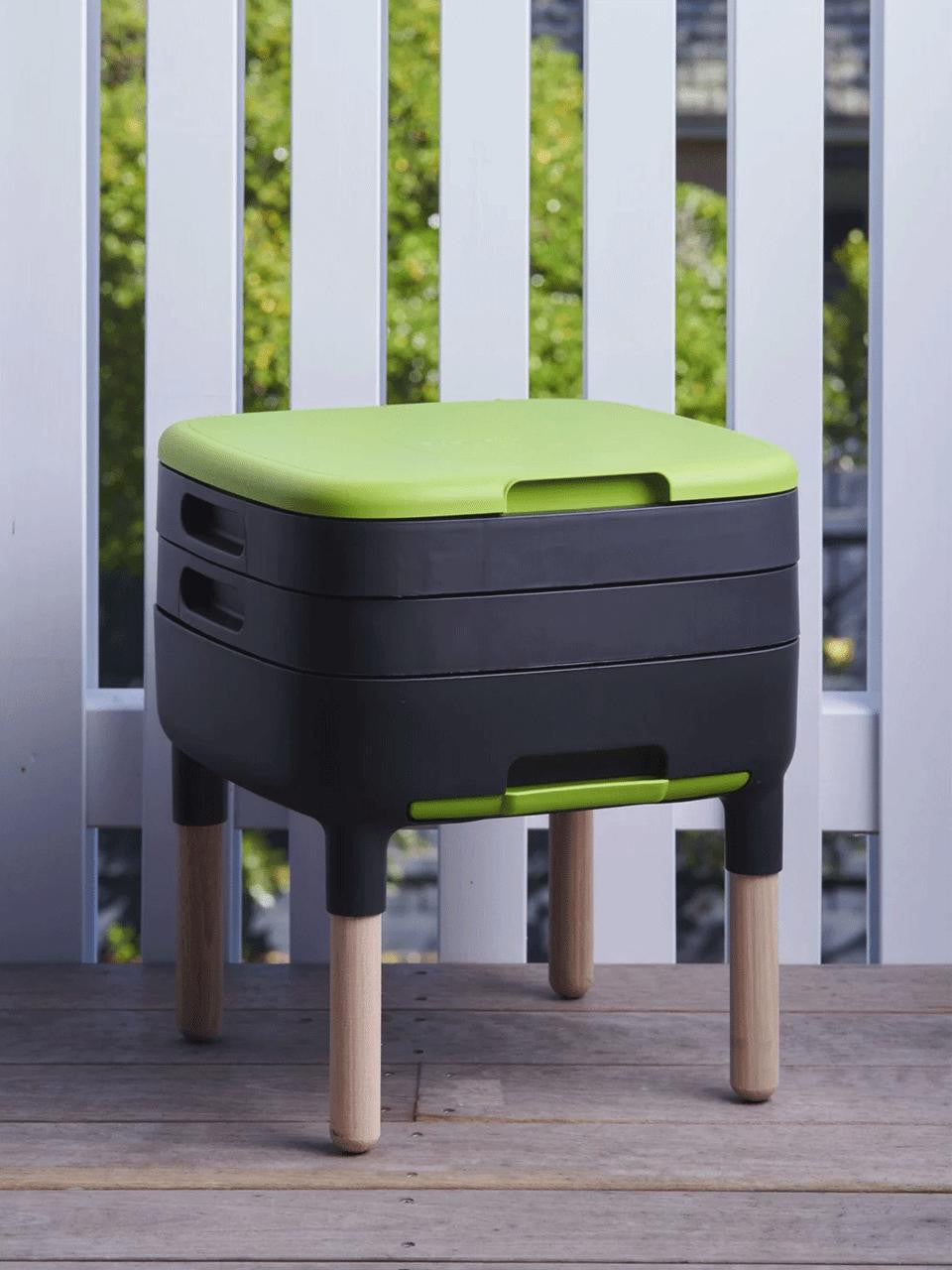 Wooden legs for worm farm by Maze, showing sturdy, natural wood supports designed to elevate and stabilize the worm composting system.