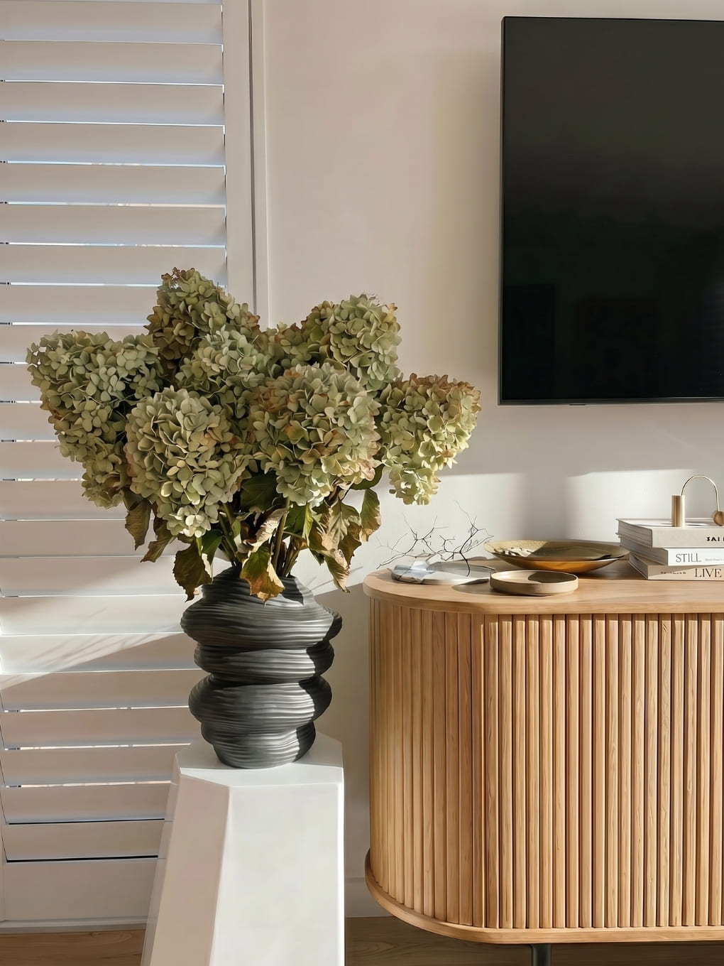 Ned Collections Capas Vase in black ceramic with a sleek, modern design, ideal for displaying flowers or decorative arrangements.