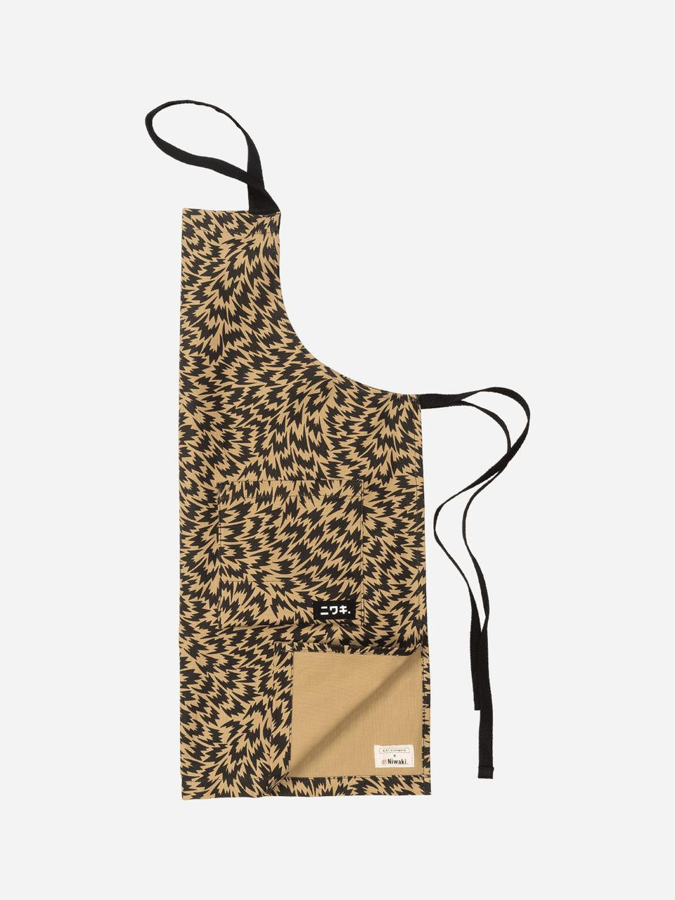 Niwaki Eley Kishimoto X Niwaki Flash Apron with adjustable straps and printed design, made for gardening or workshop use.