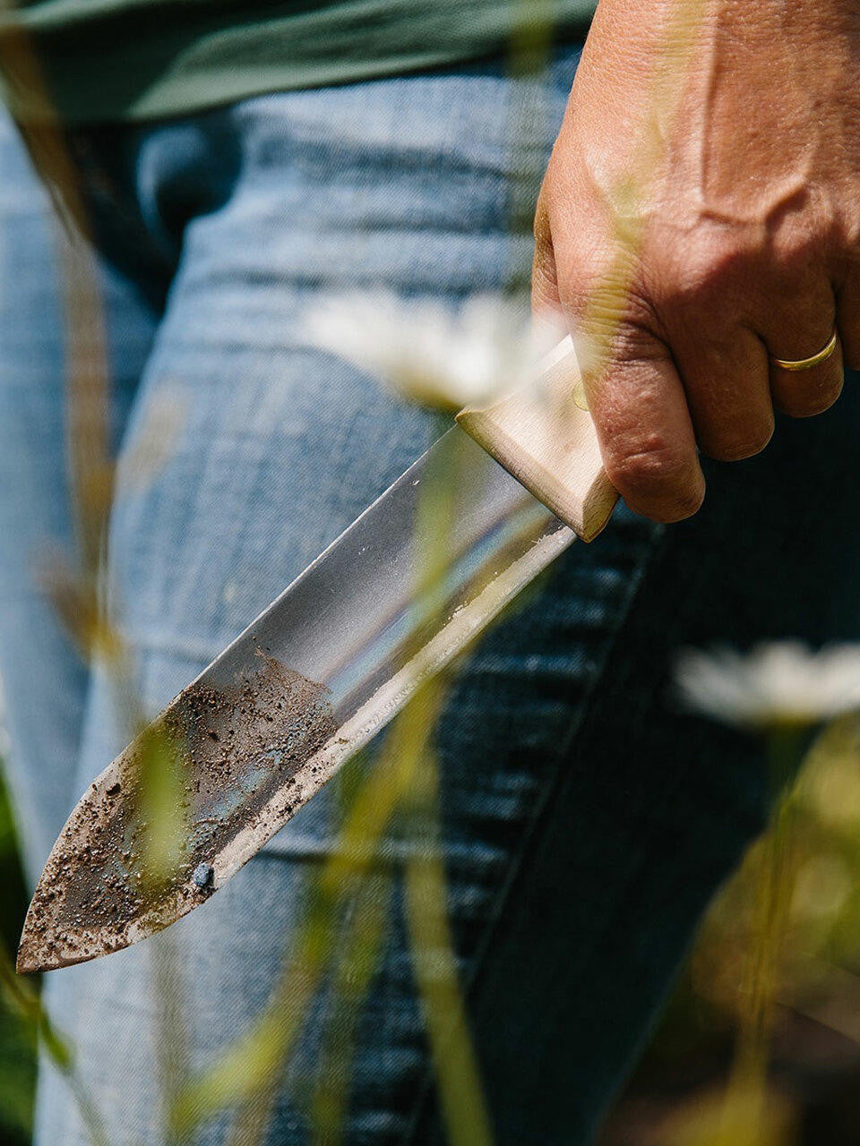 Niwaki Hori Hori Weeder with a durable canvas holster, ideal for gardening and planting tasks.