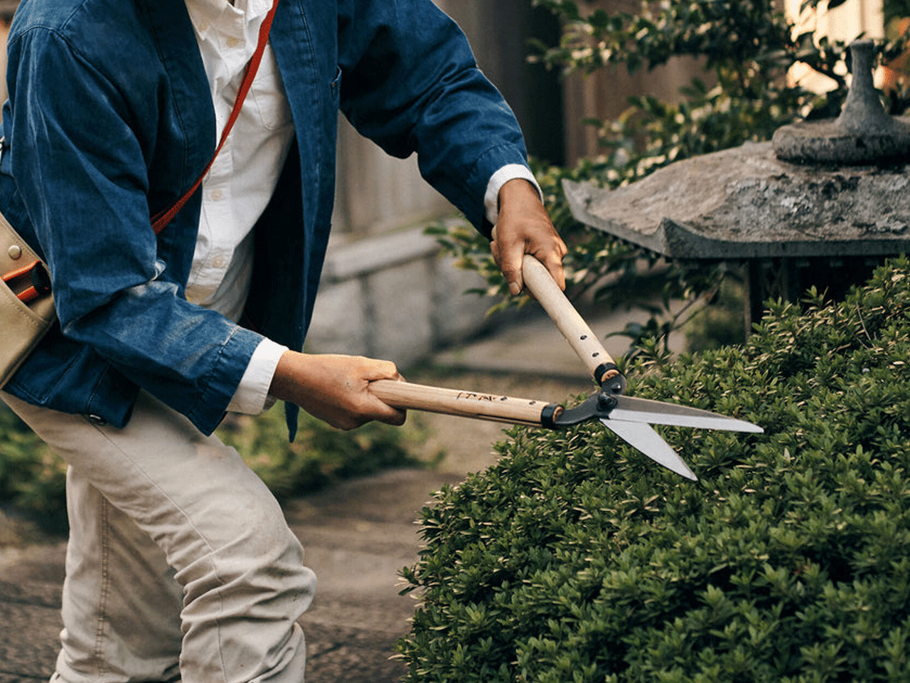 Niwaki Japanese garden shears with black handles and sharp blades for pruning and gardening tasks.