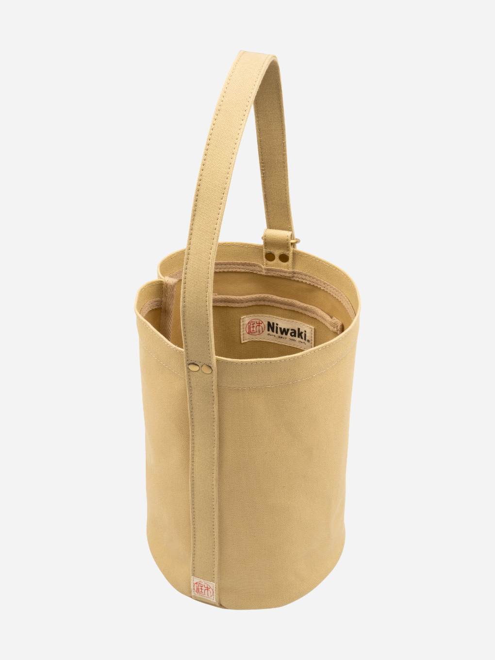 Green Niwaki Mini Kantan Bag with adjustable strap, compact design, and durable fabric for everyday use.