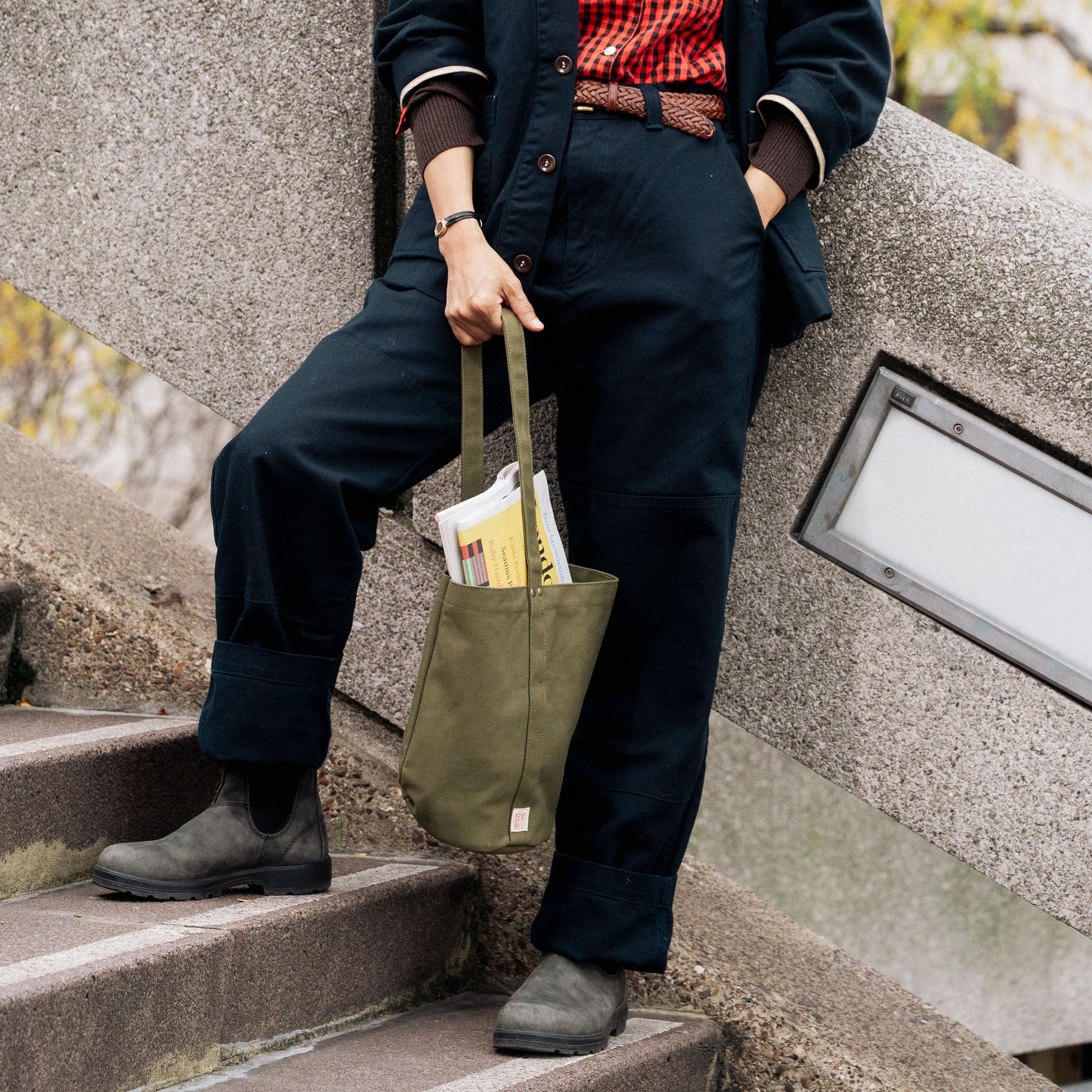 Green Niwaki Mini Kantan Bag with adjustable strap and compact design for convenient carrying.