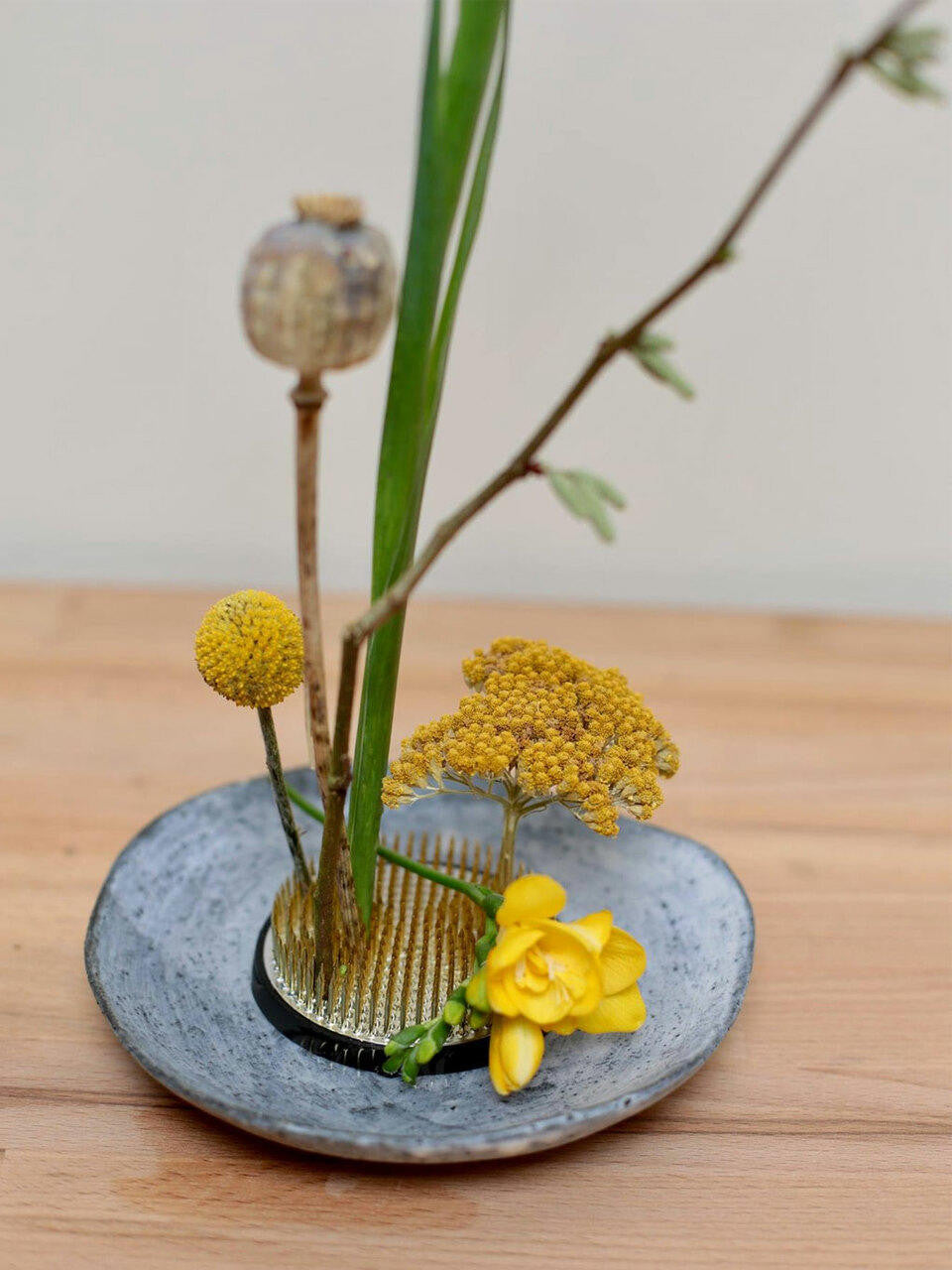 Small Niwaki Kenzan floral frog for flower arranging with metal prongs to hold stems securely.