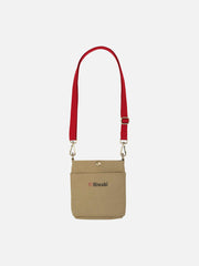 Niwaki pouch in neutral fabric with black zipper, compact and versatile storage accessory for travel or everyday use.