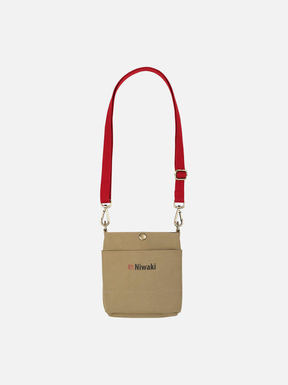 Niwaki pouch in neutral fabric with black zipper, compact and versatile storage accessory for travel or everyday use.