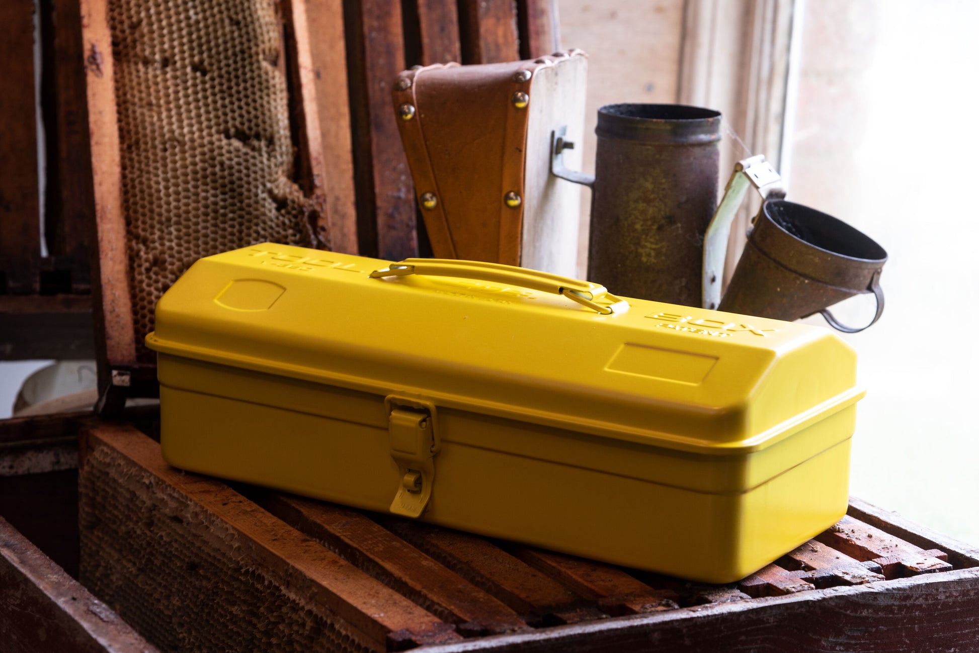 Yellow Niwaki Y-Type Tool Box with handle and compartments for organizing gardening tools.
