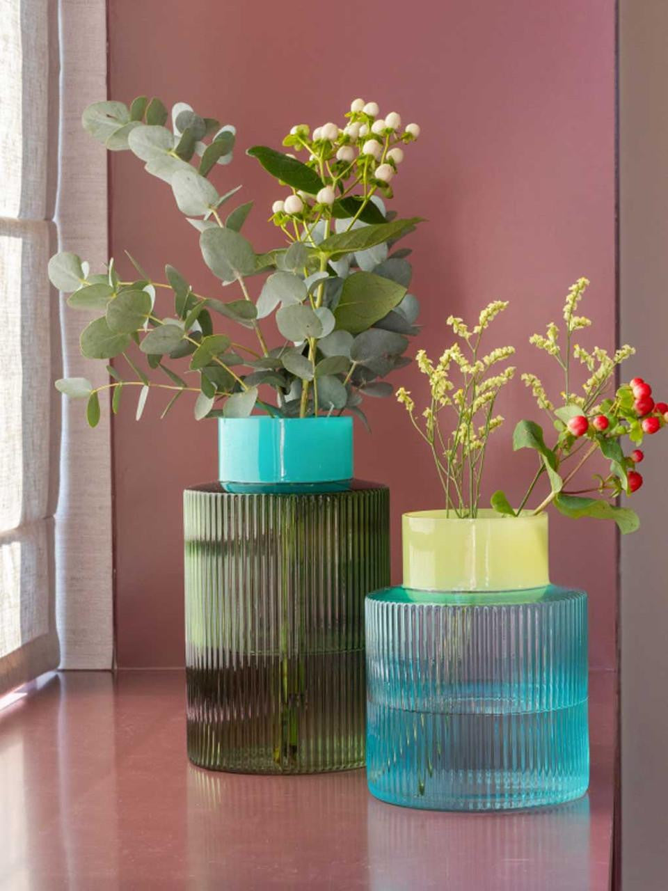 Remember fluted blue vase with a glossy finish, showcasing its elegant ridged design and vibrant color on a neutral background.