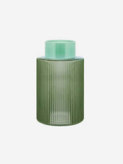 Green fluted glass vase by Remember with a textured, ribbed surface for decorative floral arrangements.