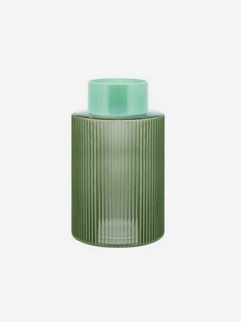 Green fluted glass vase by Remember with a textured, ribbed surface for decorative floral arrangements.