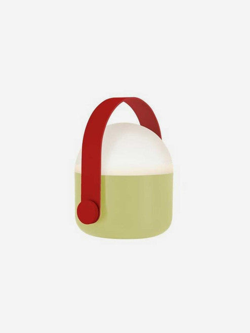 Remember Lamp Ole in Sand color with a modern design, featuring a sleek base and cylindrical shade for stylish lighting.