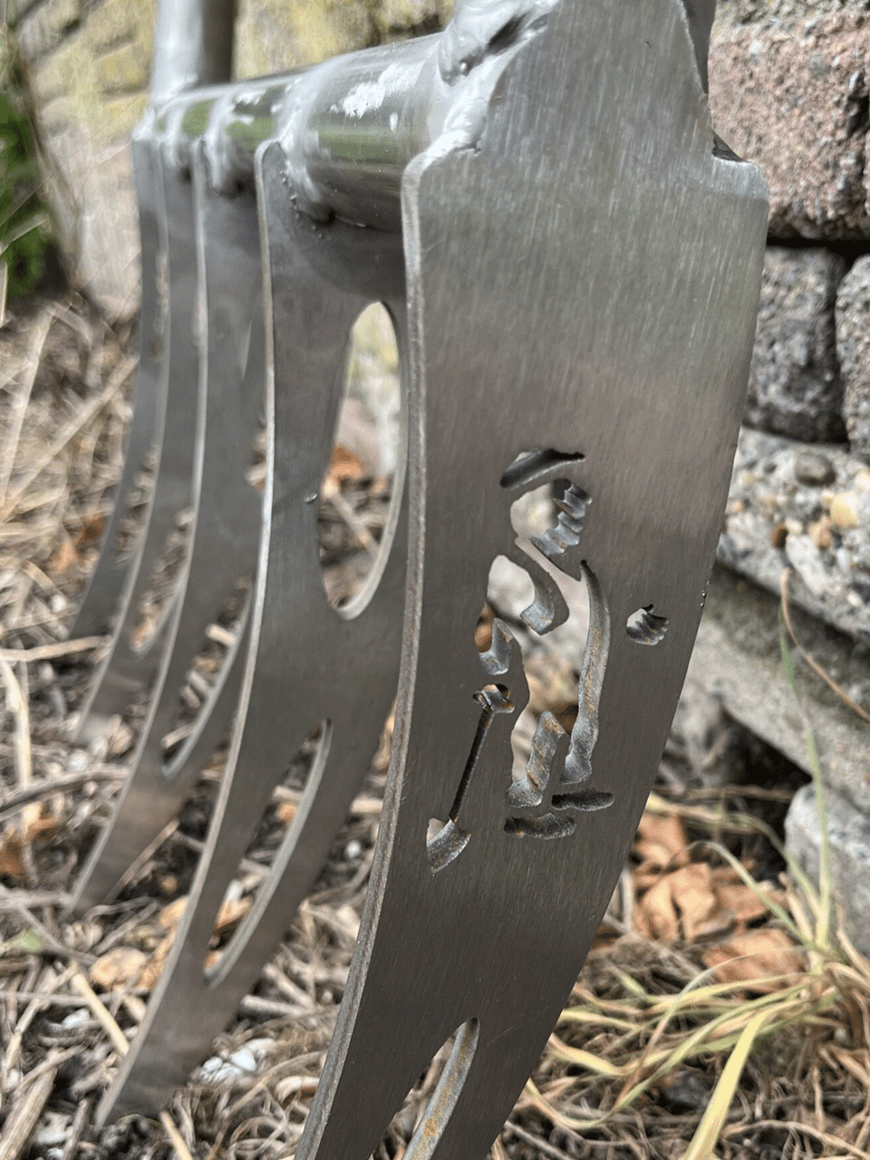 Sneeboer broadfork with sturdy wooden handle and metal tines for aerating soil in gardening and farming projects.