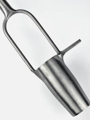 Sneeboer bulb planter with wooden handle and metal scoop for planting bulbs in garden soil.