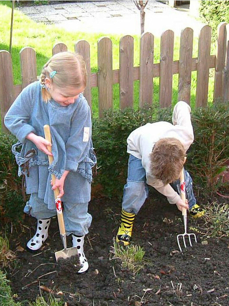 Children's fork by Sneeboer featuring a stainless steel handle and small fork tines, designed for easy use by kids.