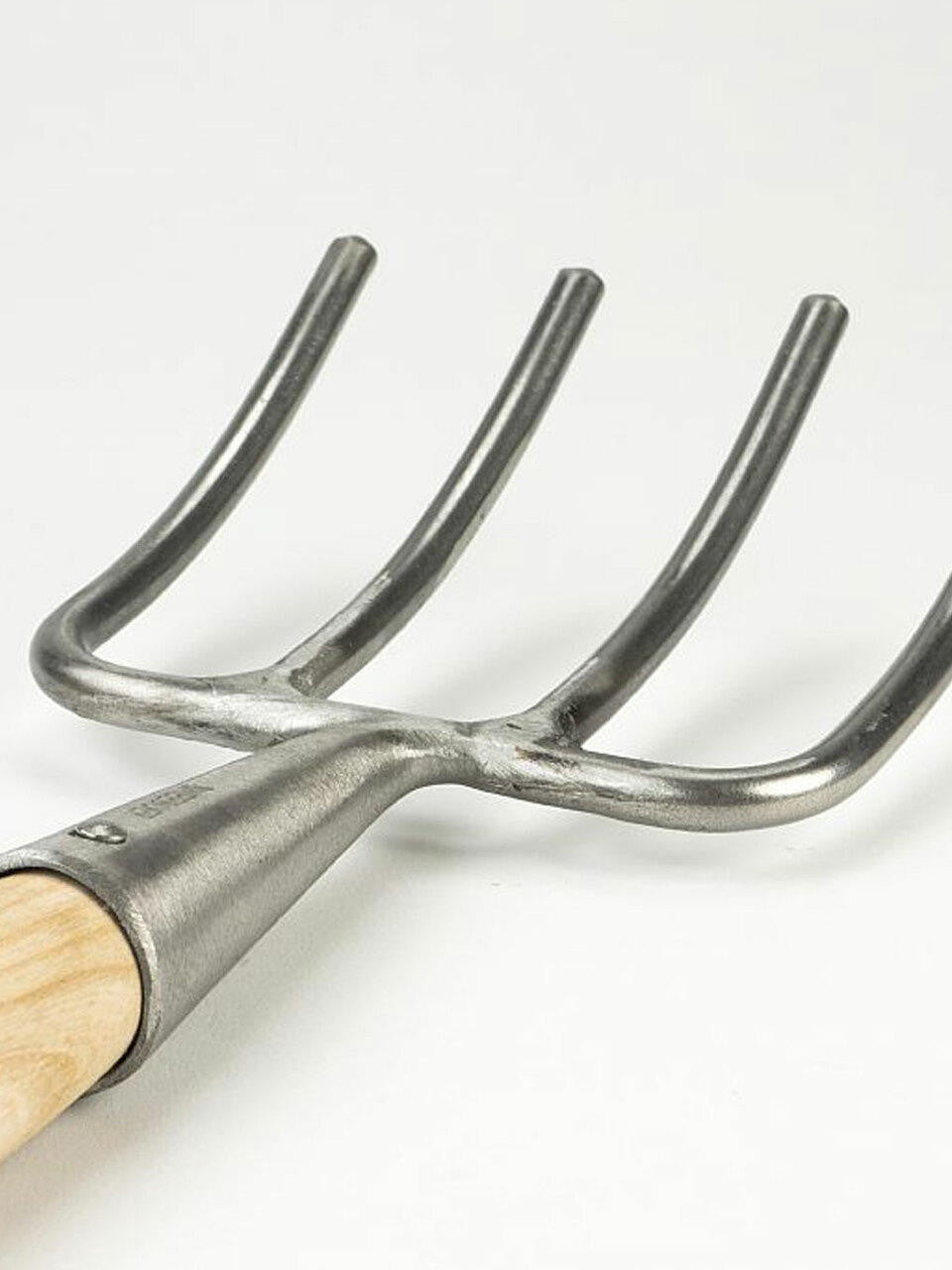 Children's fork by Sneeboer with a stainless steel handle and four tines, designed for young kids' dining.
