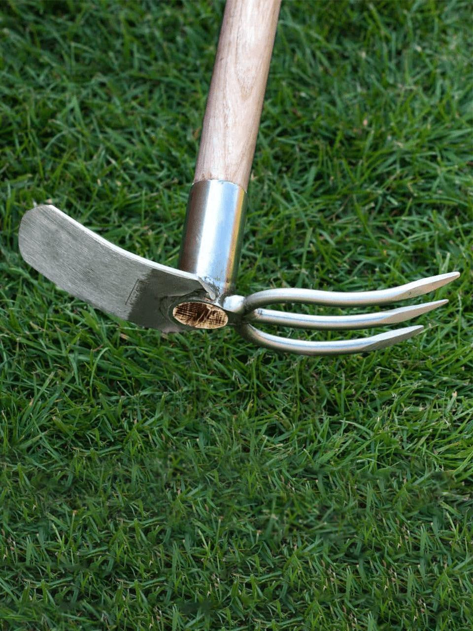 Sneeboer fork and mattock set with wooden handles, ideal for gardening and digging tasks. Durable stainless steel tools.