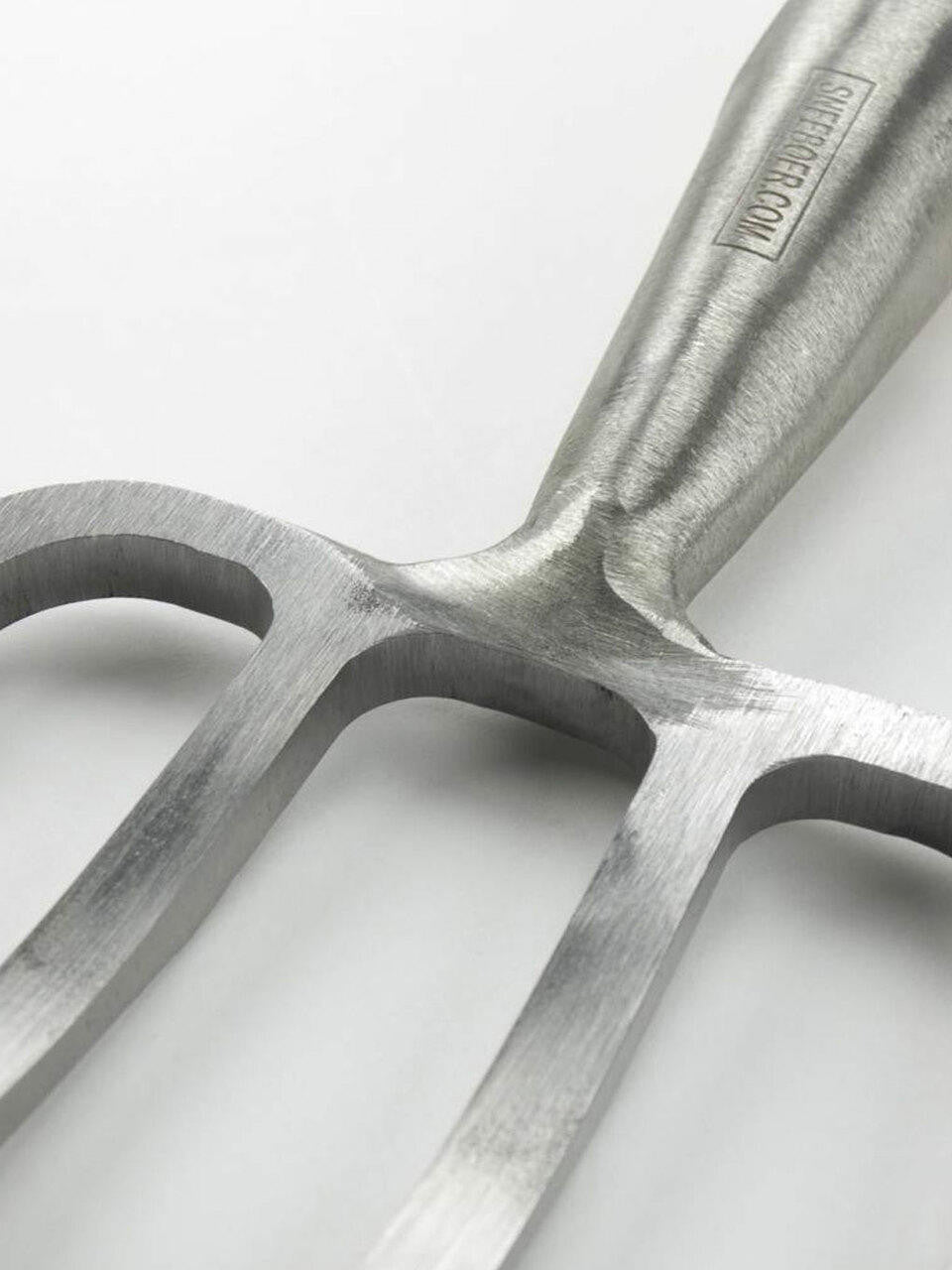 Sneeboer Great Dixter Fork with four tines, sturdy garden hand tool for planting and soil aeration, made of durable material.